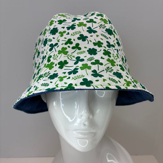 Reversible hat with green shamrock pattern and blue denim