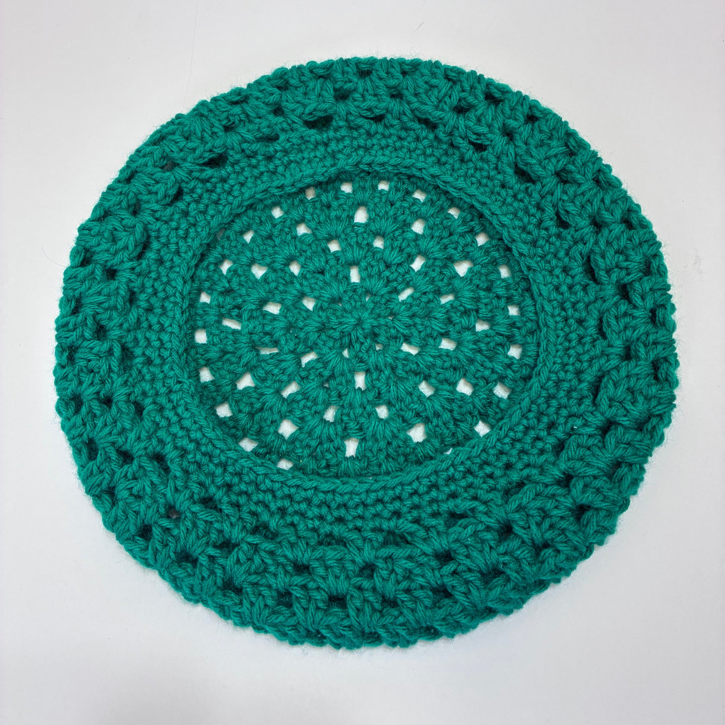 Green crocheted beret