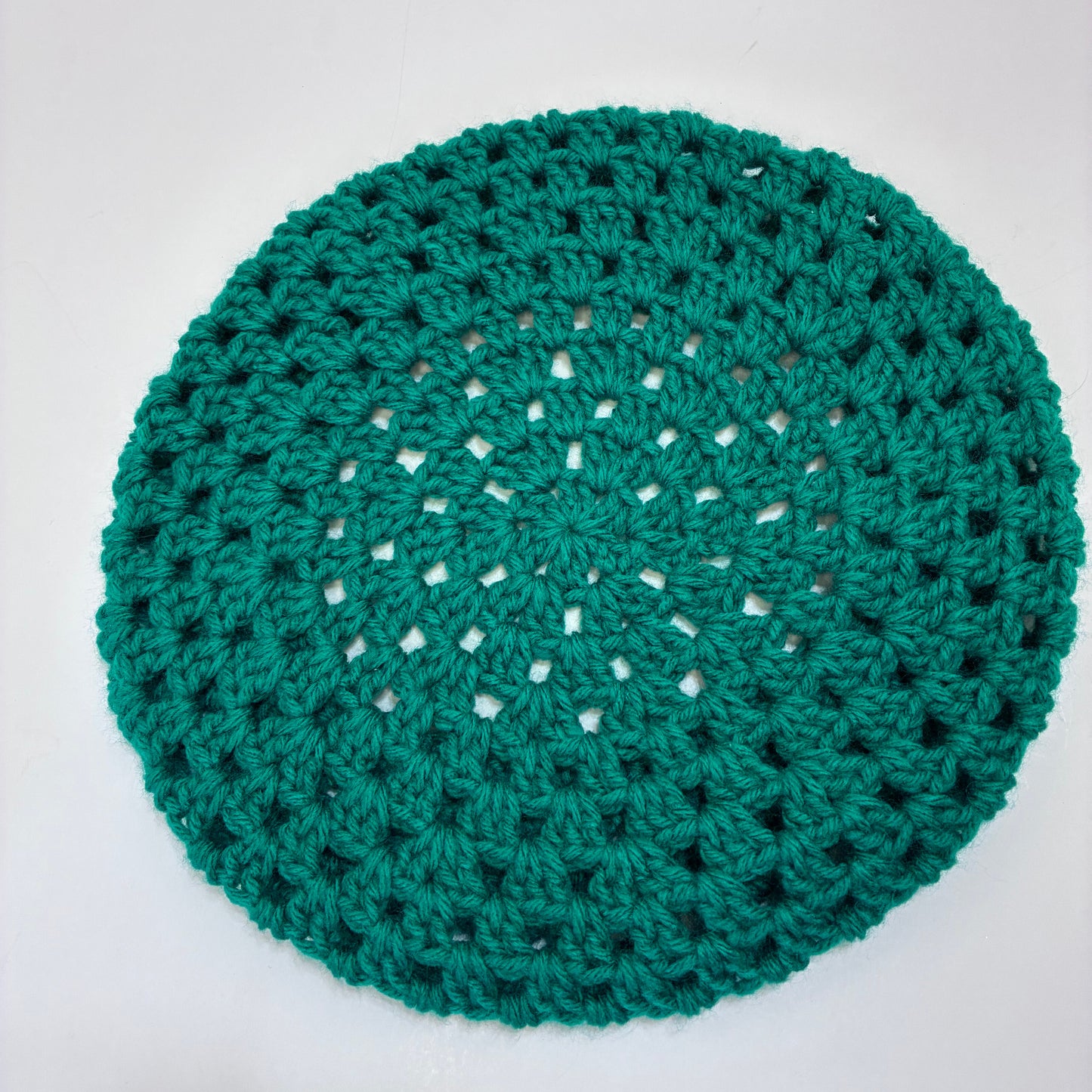 Green crocheted beret