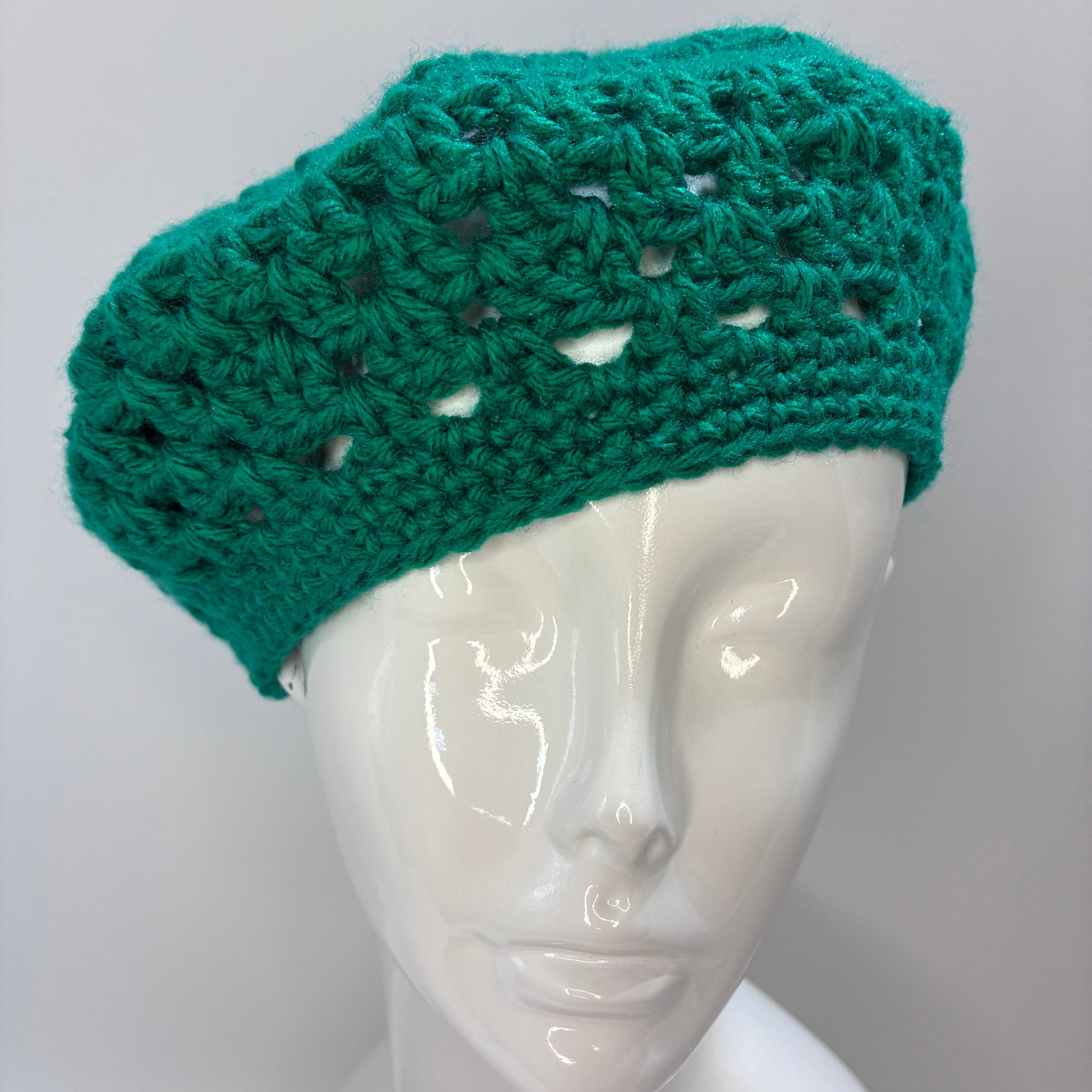 Green crocheted beret