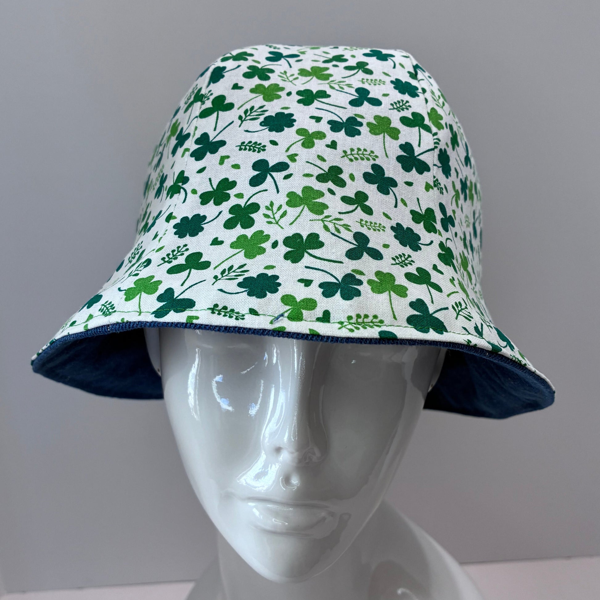  Reversible blue denim hat with green shamrock pattern 