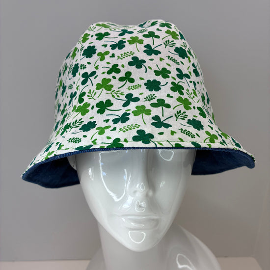 Reversible hat with green shamrock pattern and blue denim